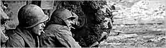 The War - Soldiers resting behind a tank