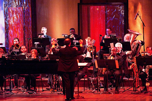 Conductor Arranger Scott Hall Guides the Orchestral Movements