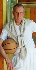 [photo: man with basketball]