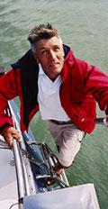 [photo: man sailing]