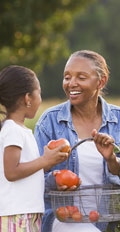 [photo: grandma picking tomatoes]
