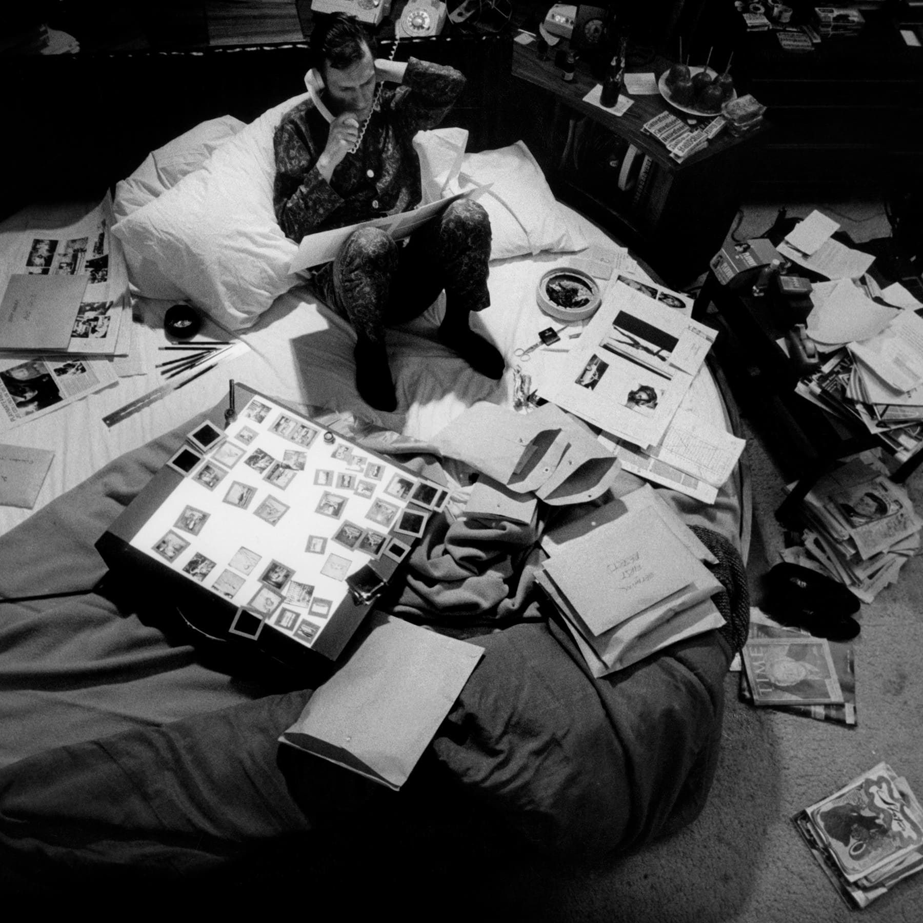 Hugh Hefner working from bed in the Playboy Mansion in 1966.