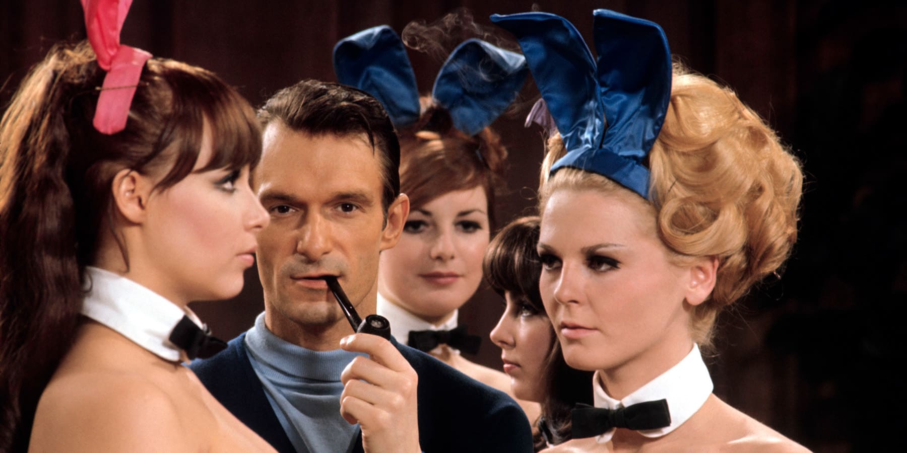 Hugh Hefner pictured with Playboy Bunnies in 1966