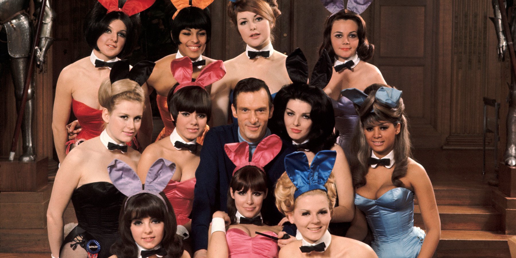 Hugh Hefner posing with Bunnies in 1966