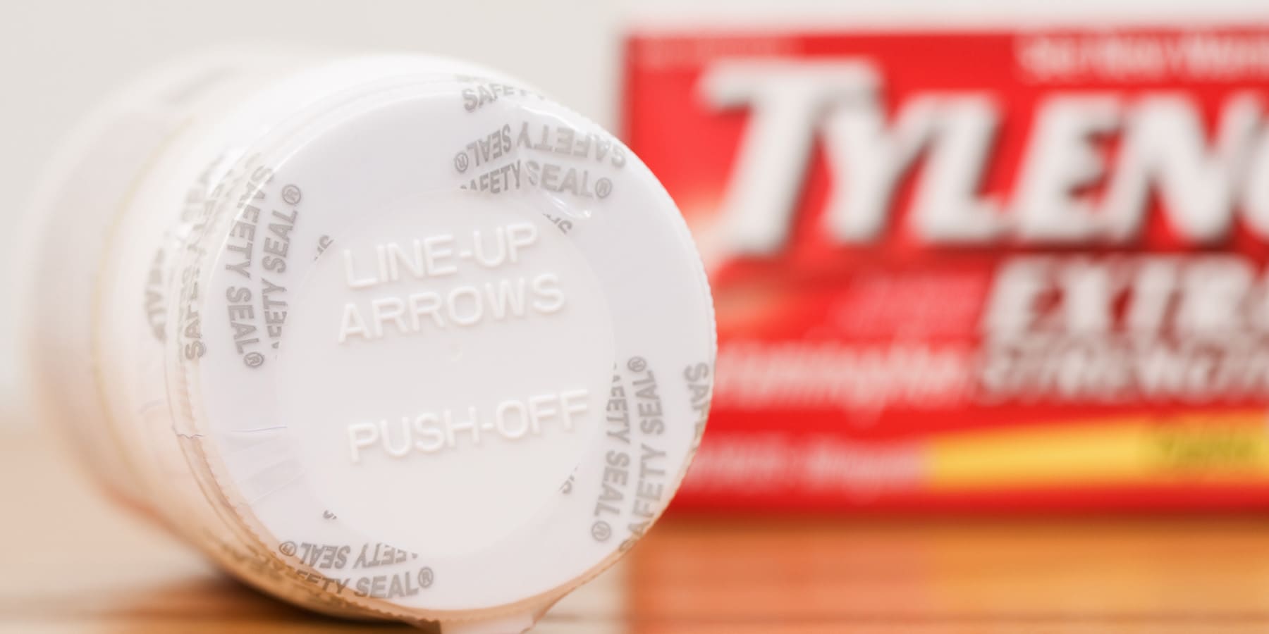 Bottle of Tylenol showing the safety seal with the box in the background