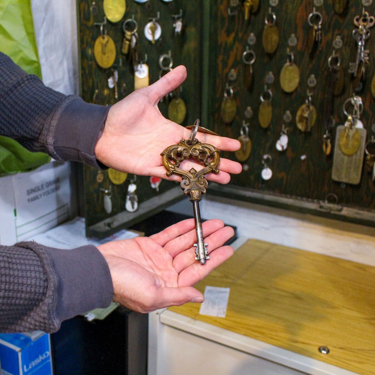 Pastor Juarez holds an old-fashioned key to the Potter family mausoleum.