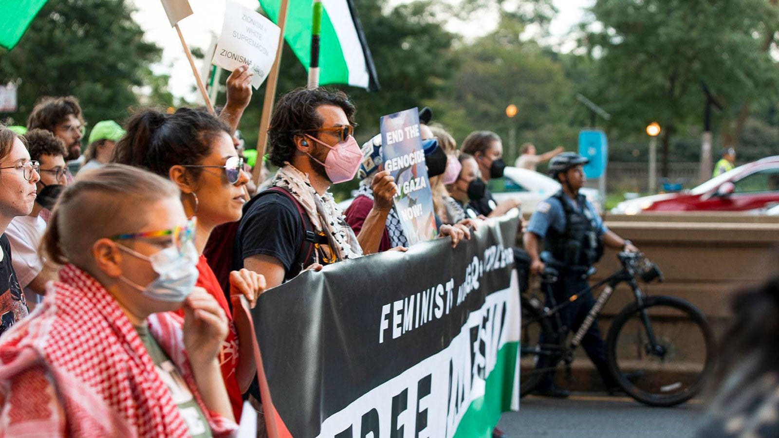 Protesters march down Michigan Avenue in Chicago on Sunday, Aug. 18, 2025, ahead of the start of the Democratic National Convention.