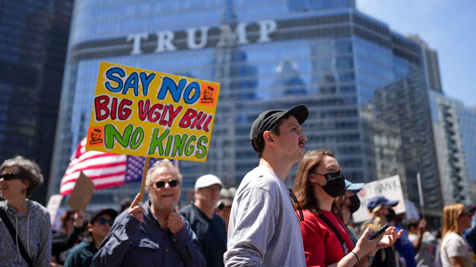 Protesters march down Michigan Avenue in Chicago on Sunday, Aug. 18, 2025, ahead of the start of the Democratic National Convention.