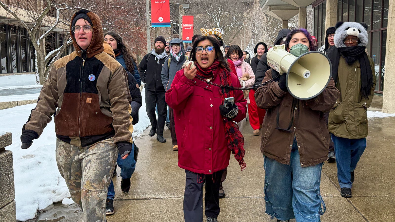 Students at the University of Illinois Chicago, led by River Argyilan, left, and Ileanne Cecilio, middle, march on campus on Jan. 30, 2026, as part of a nationwide student walkout in solidarity with Minneapolis and to protest federal immigration enforcement policy. (Eunice Alpasan / WTTW News) 