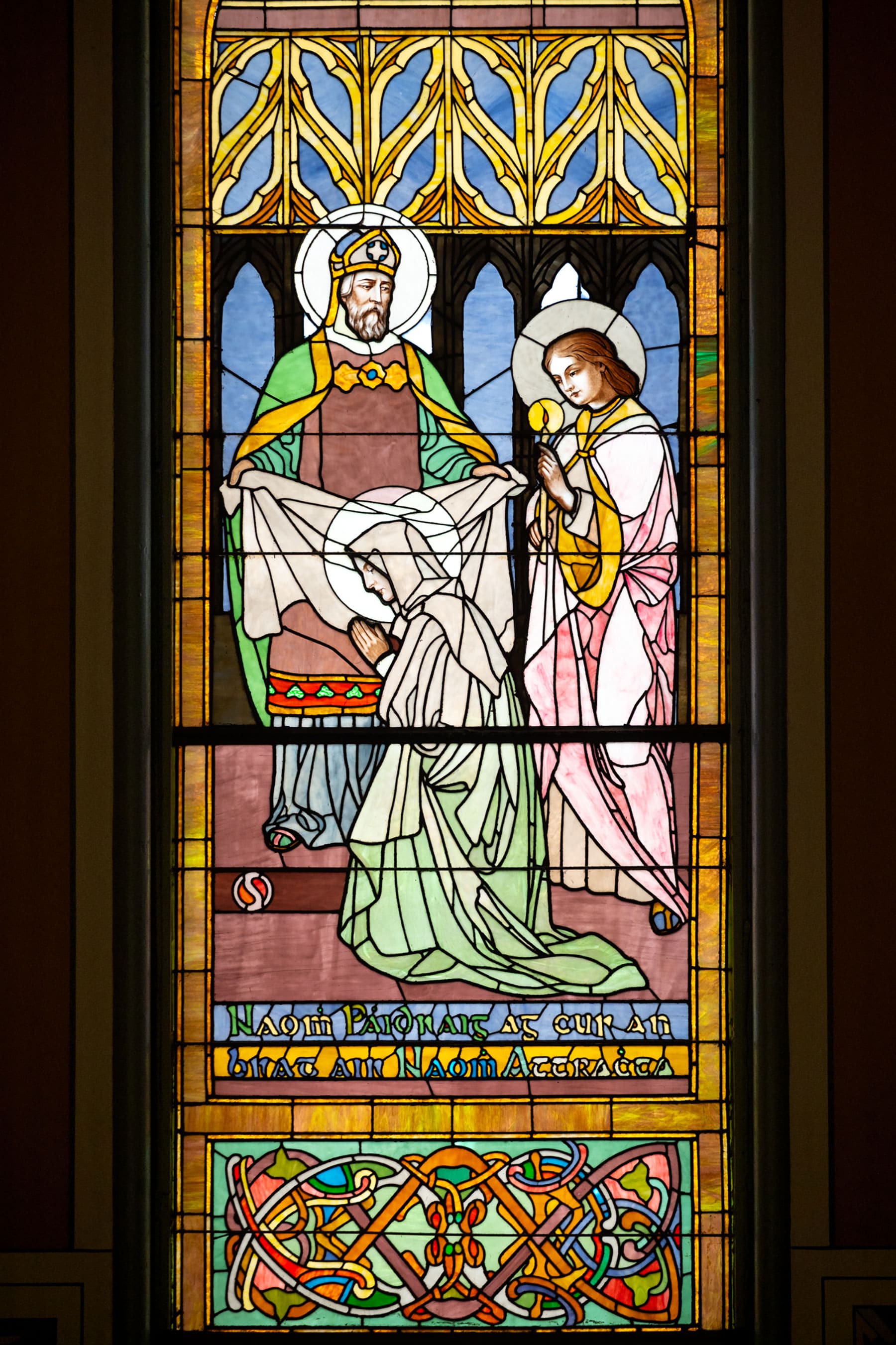 A stained-glass window that depicts St. Attracta taking her vows before St. Patrick, the patron saint of Ireland