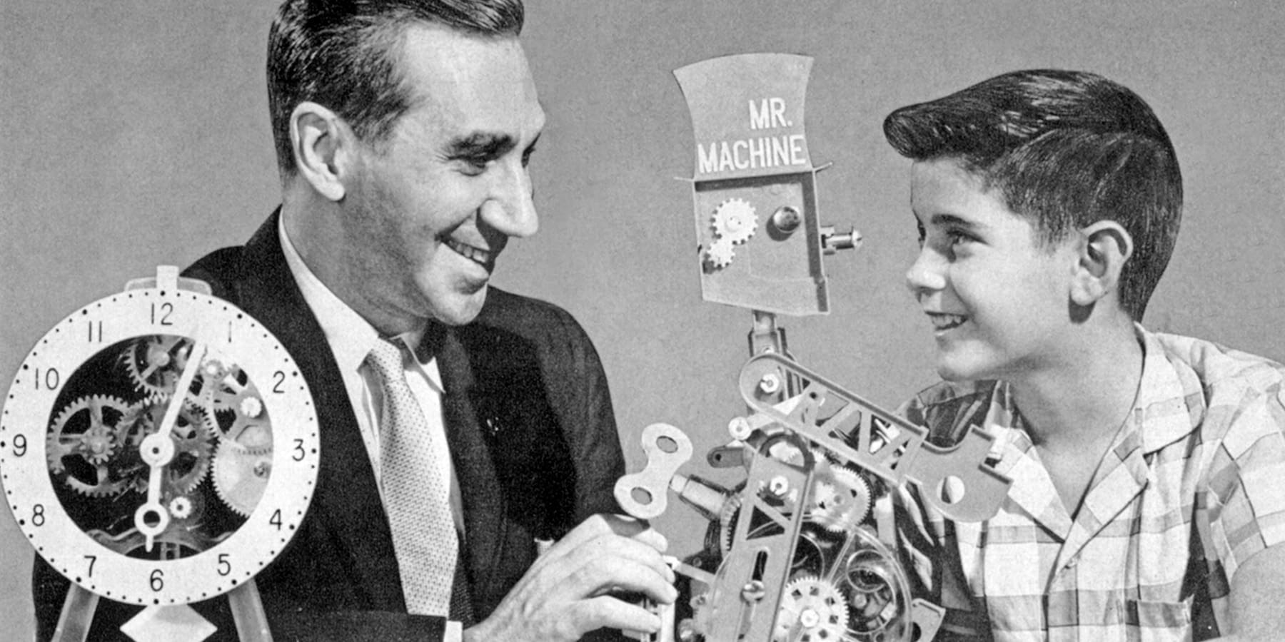Marvin Glass, left, demonstrates his Mr. Machine toy.