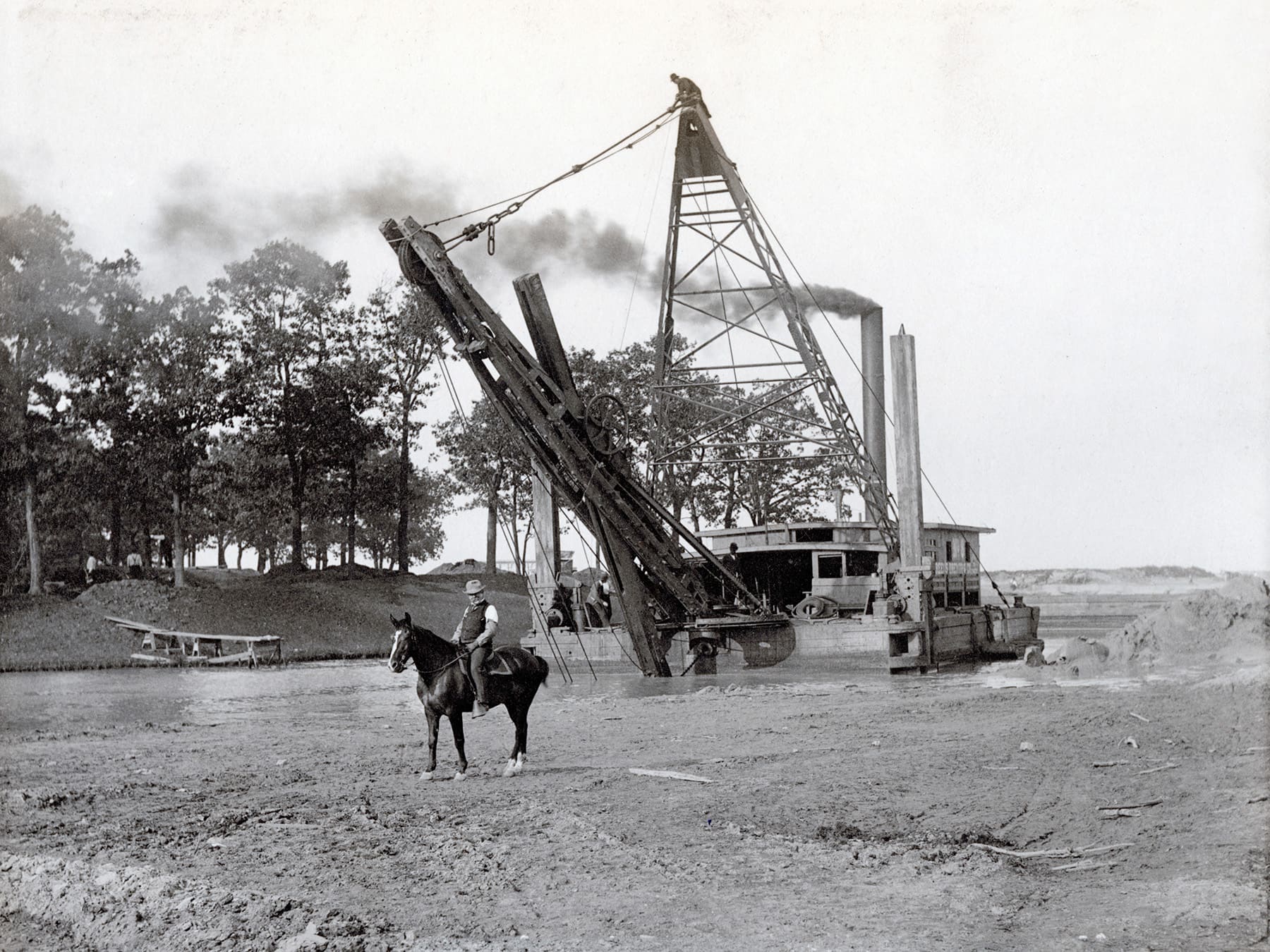 A steam dredge prepares a lagoon for the World’s Fair.