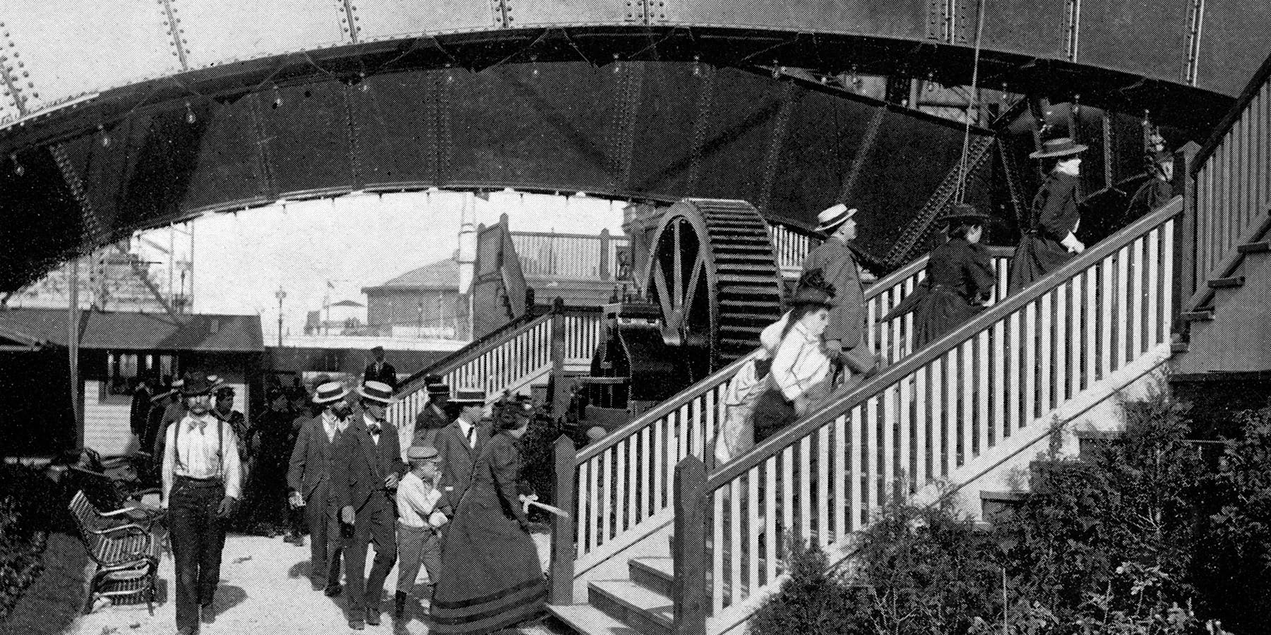 Fairgoers approach the boarding area for the Ferris wheel.