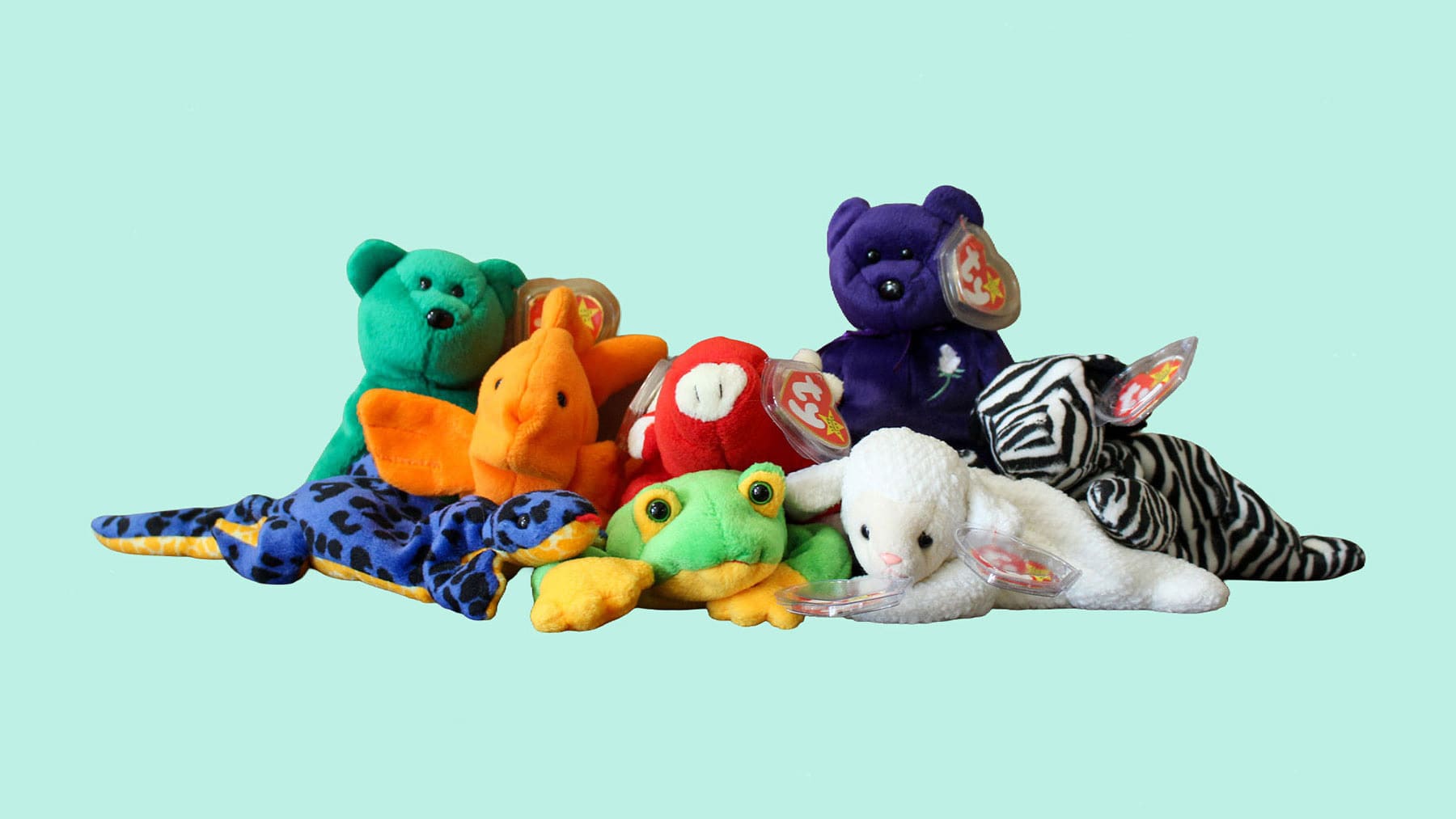 A variety of Beanie Babies, including the purple 1997 Princess Diana commemorative Beanie Baby bear