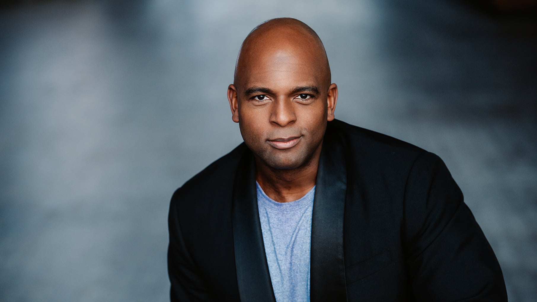 A headshot of Ryan Speedo Green