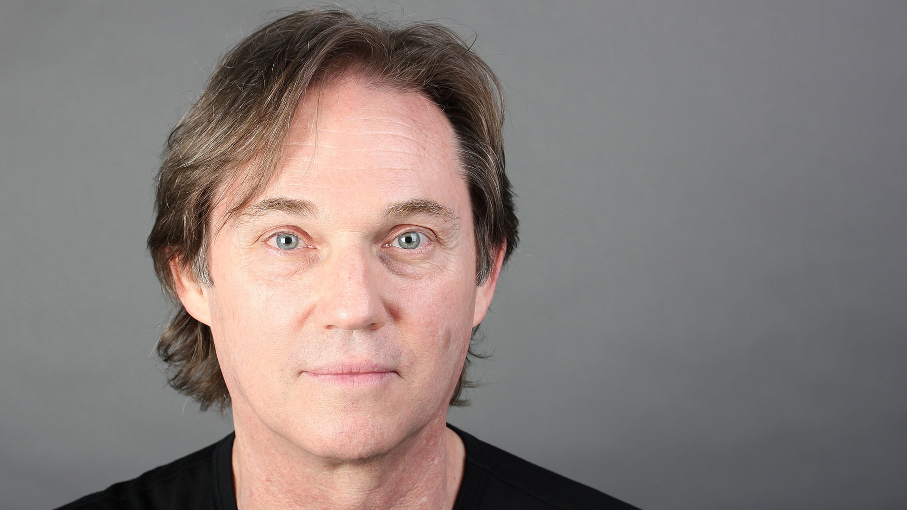 A headshot of Richard Thomas