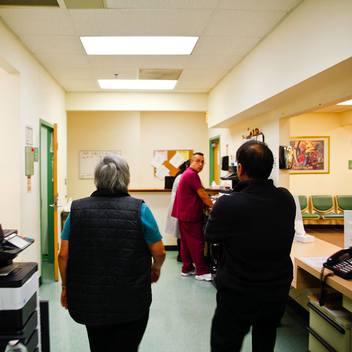 Carmen Vel&aacute;squez walks through the clinic with Dr. Bhurgri