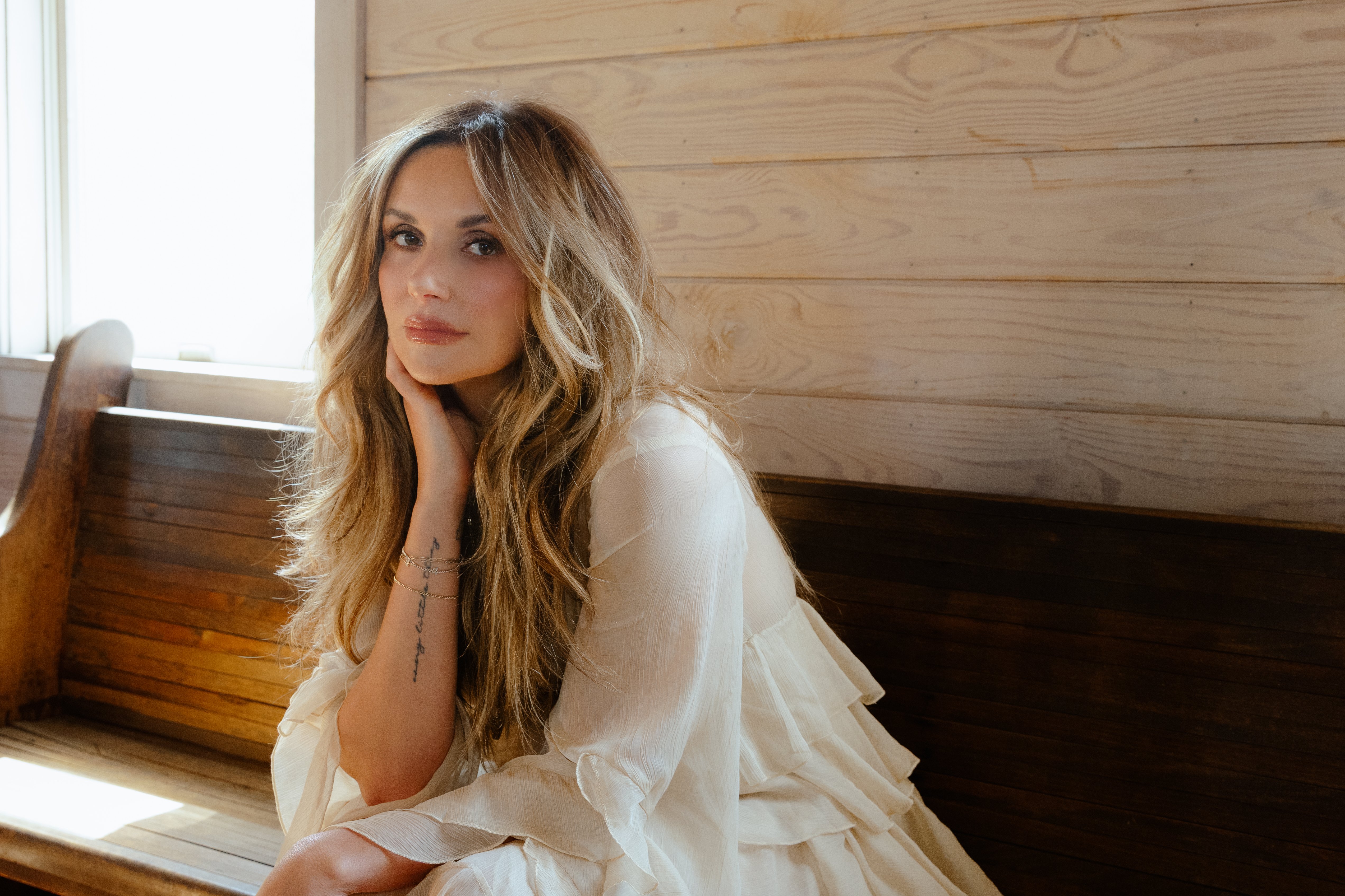 A headshot of Carly Pearce