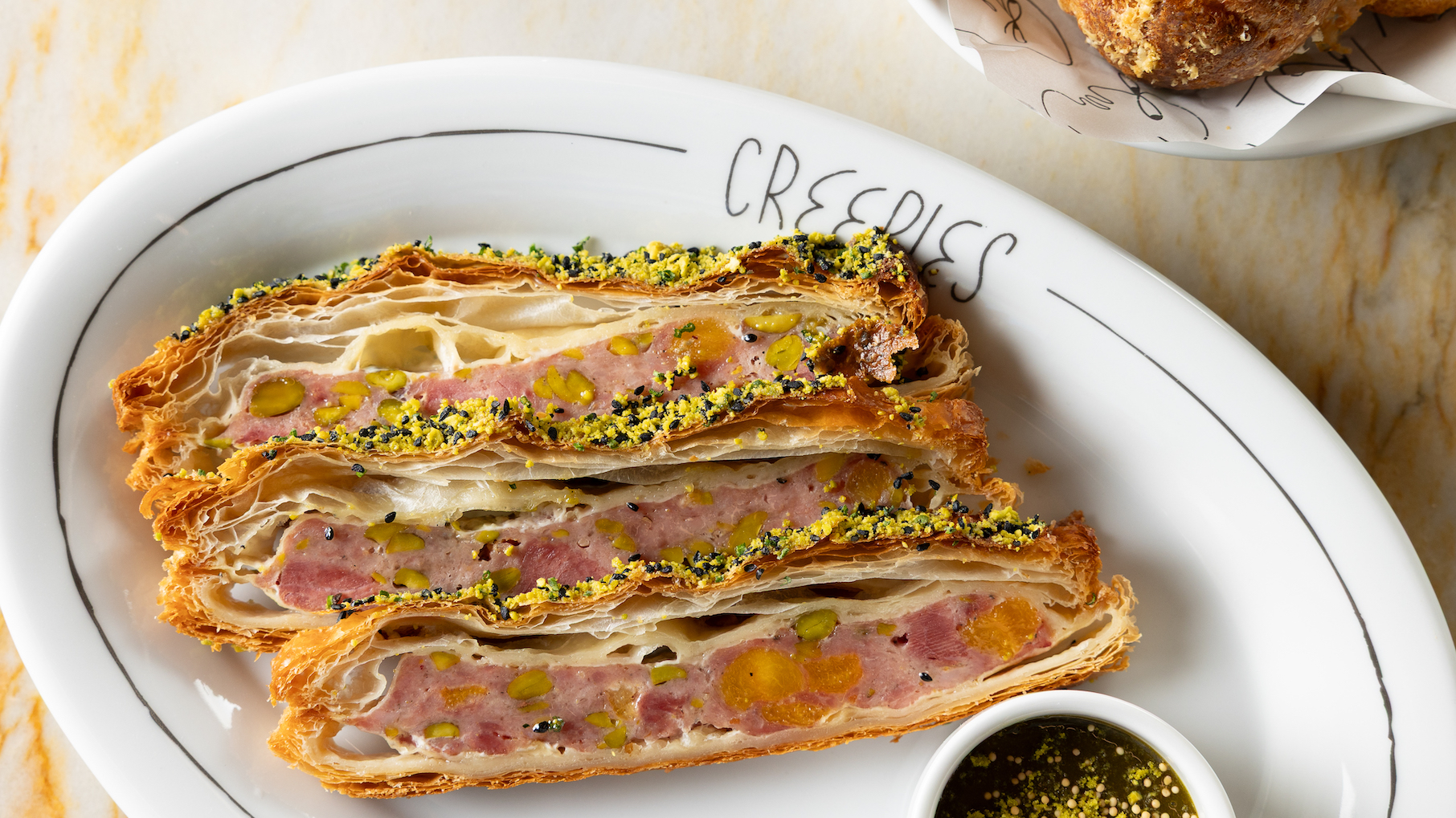 A saucisson in puff pastry on a plate