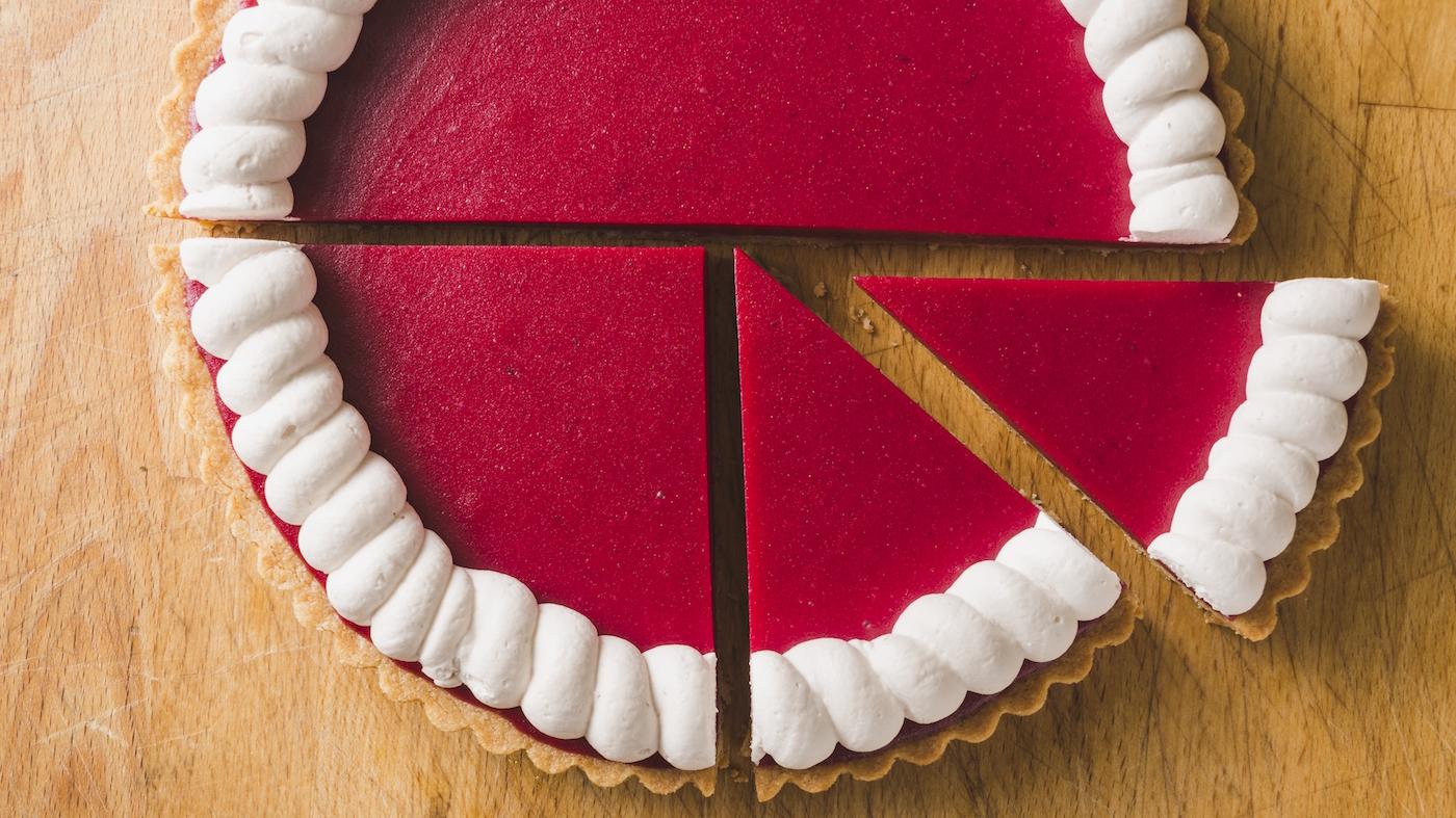 Cranberry Curd tart with slices cut out and set slightly apart
