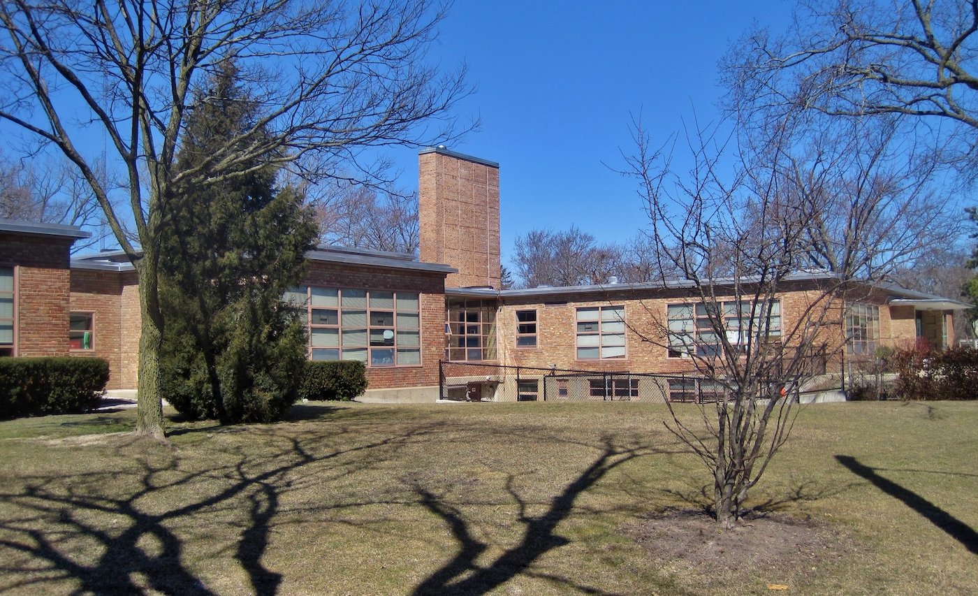 Crow Island School, a low-slung building with a tower at the center