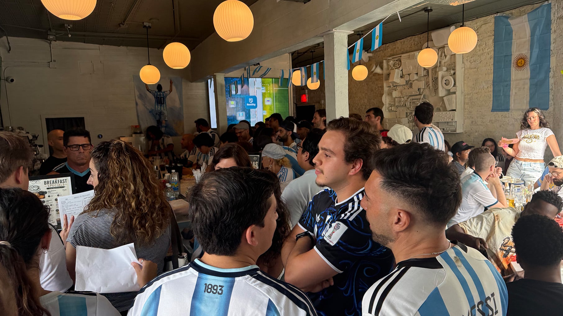 Argentine soccer fans gather in a restaurant