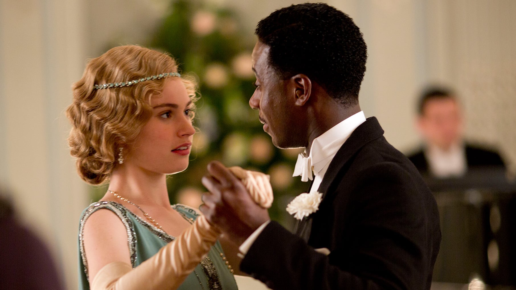 Rose dances with a man in a tuxedo