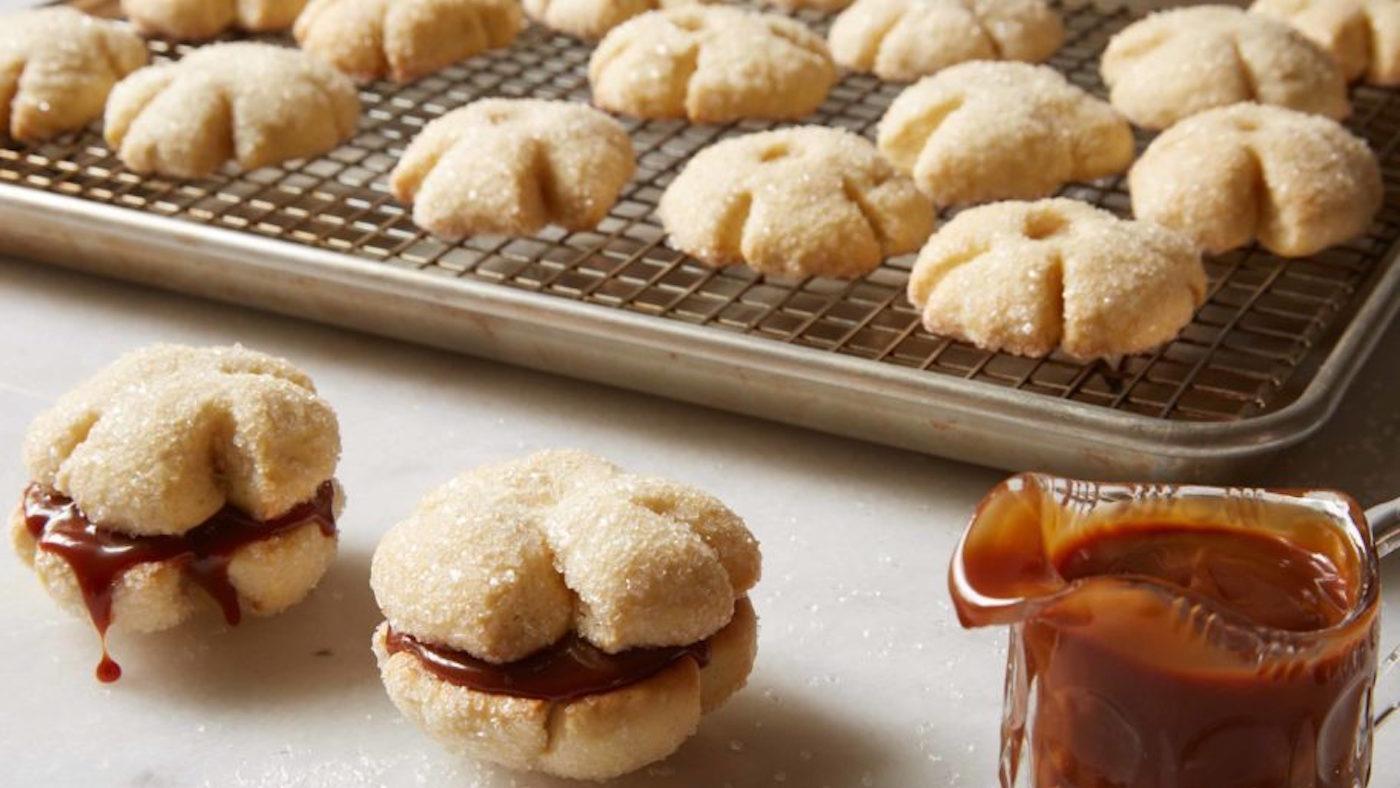 Bizcotela Vestida cookies spread out over a a sheet pan