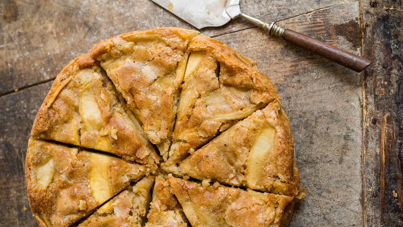 A French Apple Cake on a wooden table