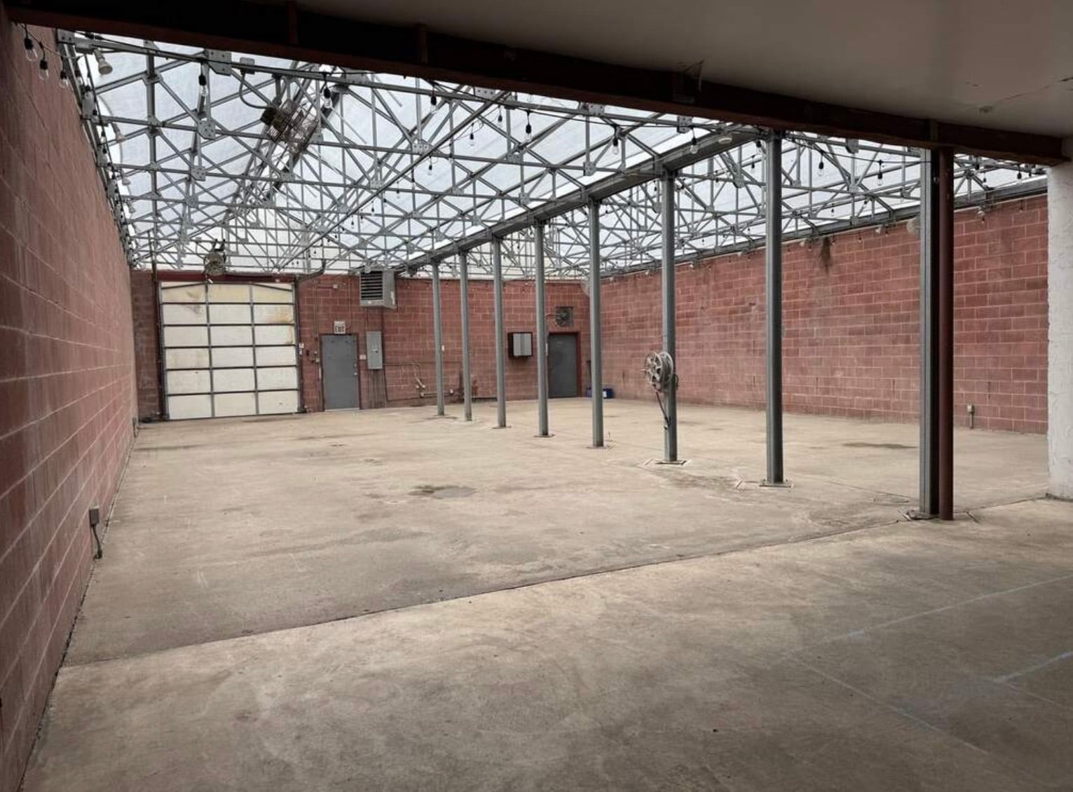 An empty interior of a greenhouse building