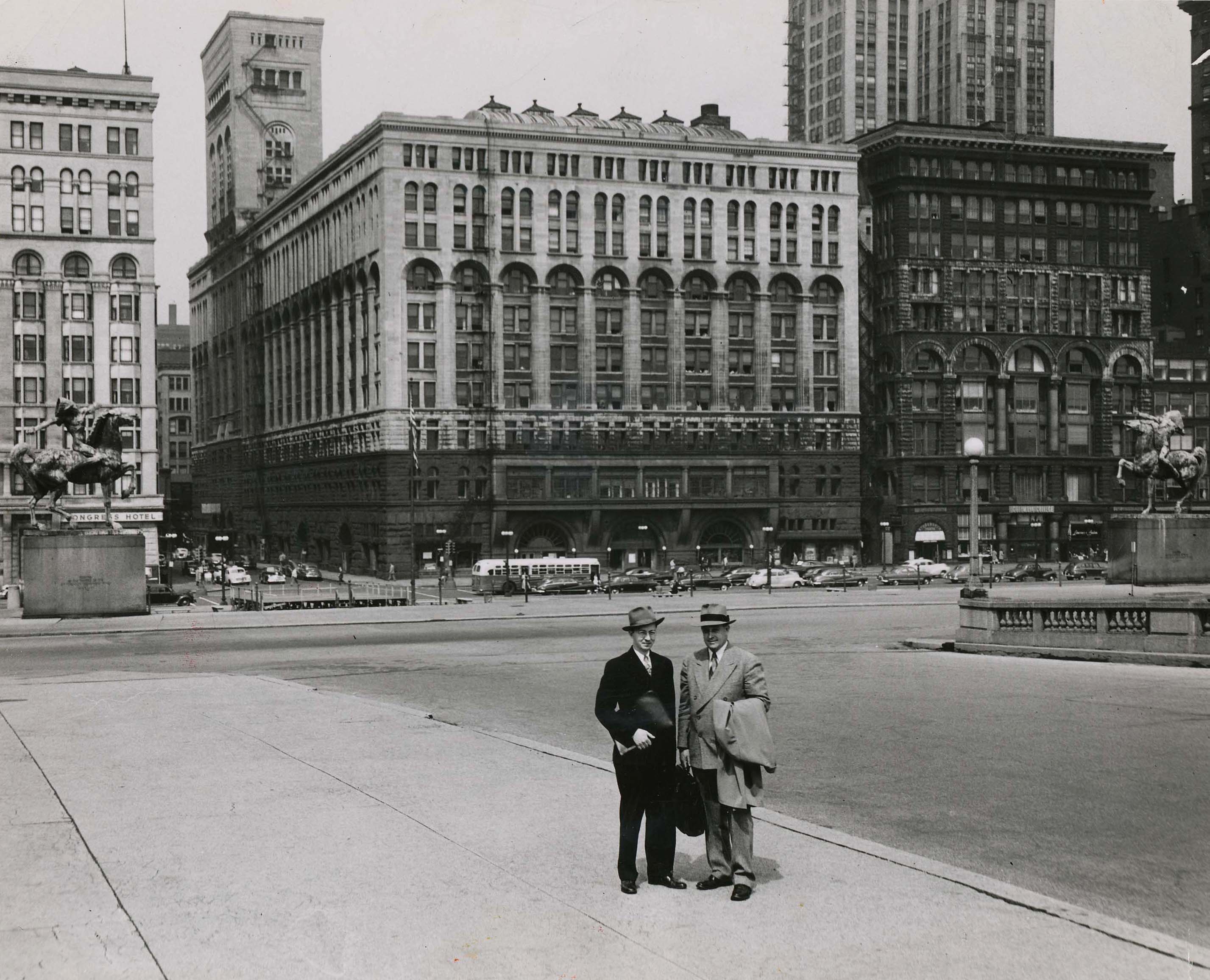 Edward J. Sparling (at right, with unidentified person) in front of the Auditorium Building. Photo credit: Roosevelt University Archive
