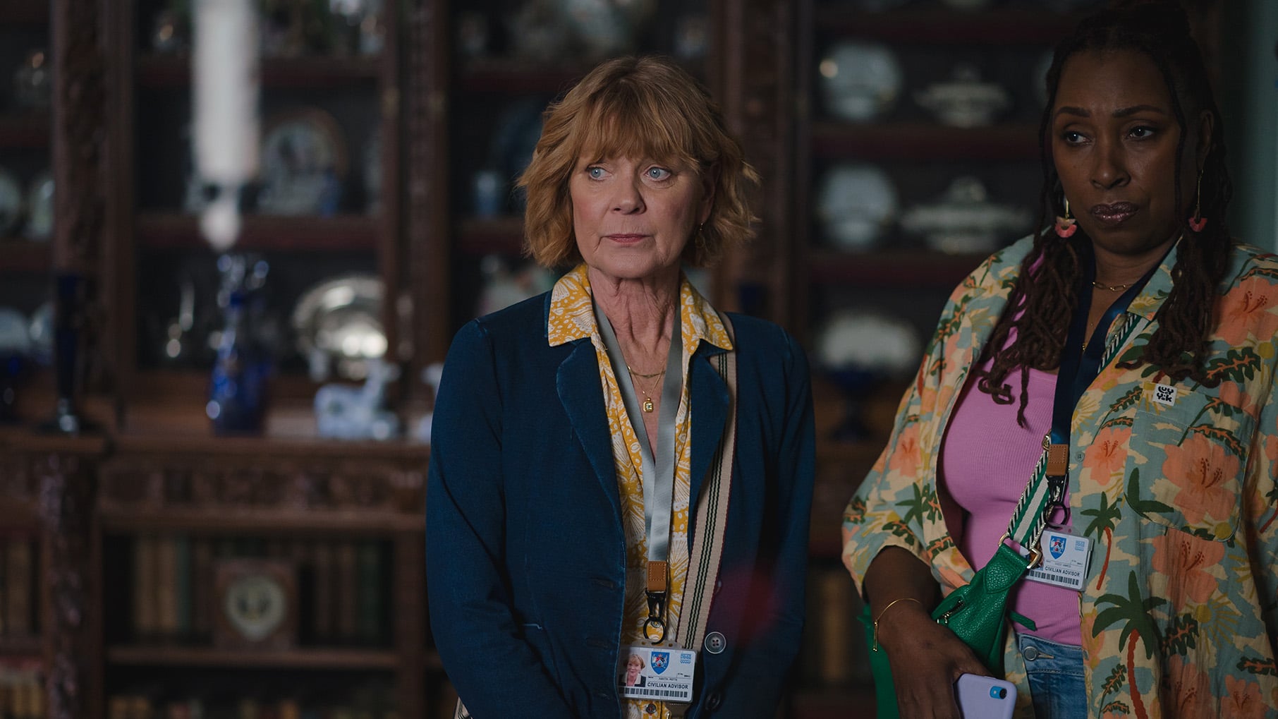 Judith and Suzie stand together inside
