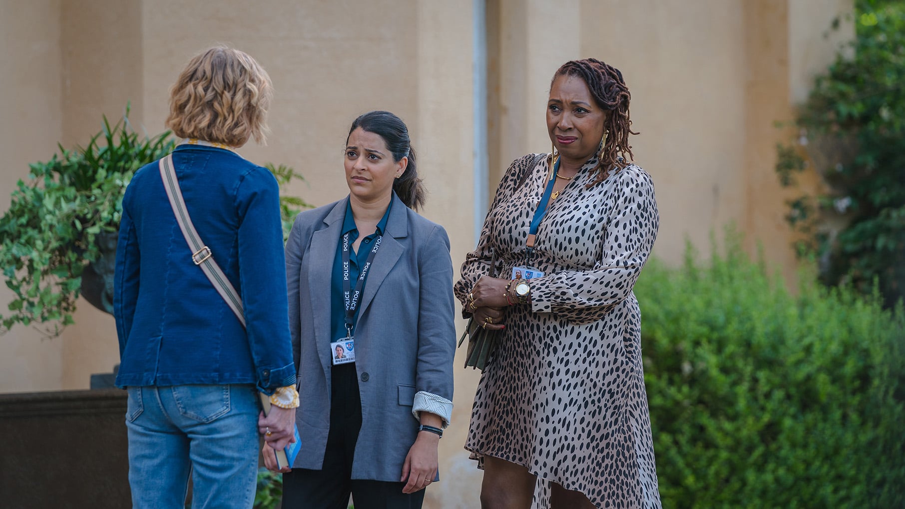 Tanika and Suzie face Judith outside