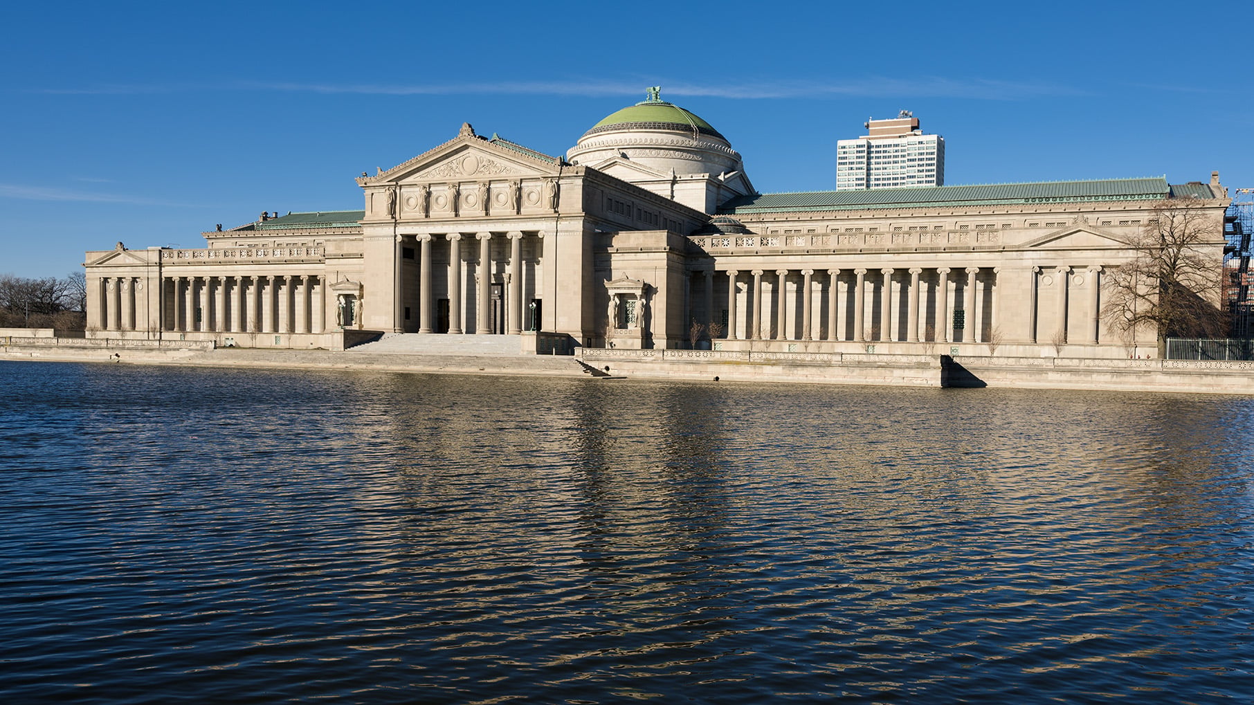 The Griffin Museum of Science and Industry is pictured from the South on the Jackson Park lagoon