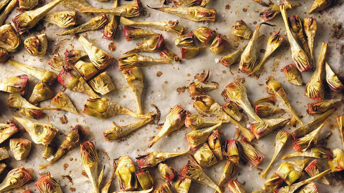 Roasted baby artichokes on a sheet pan