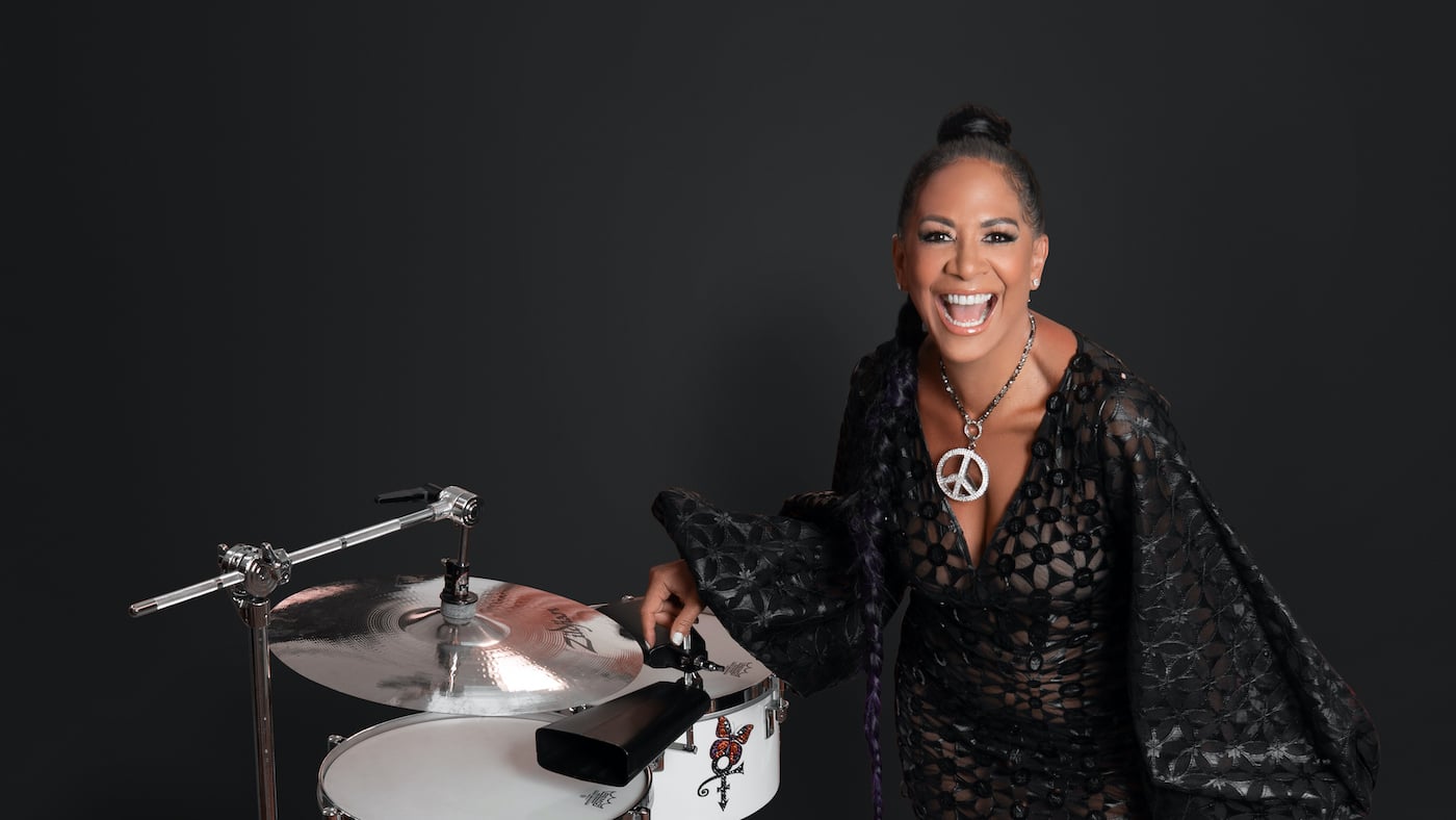 A headshot of Sheila E with drums