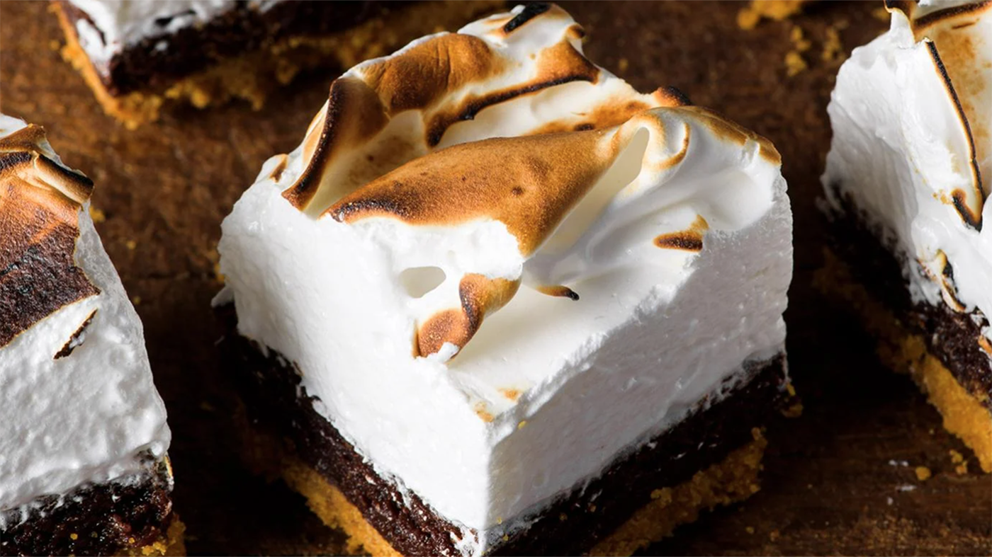 A single s'mores bar on a wooden backdrop