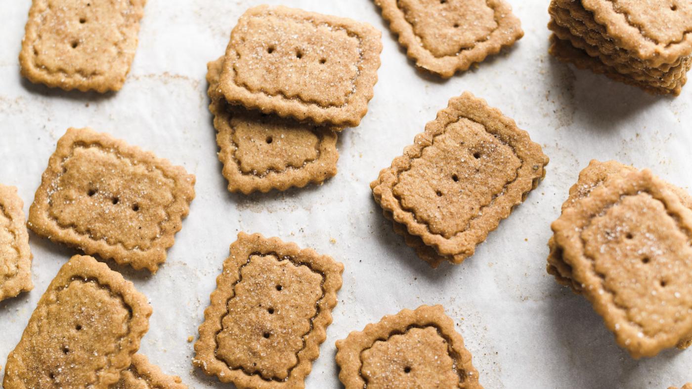 Brown rectangular cookies sitting on a white counter