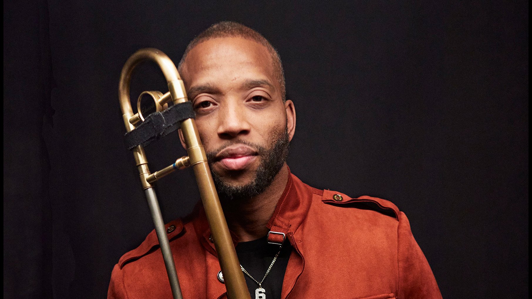 Trombone Shorty poses with his trombone