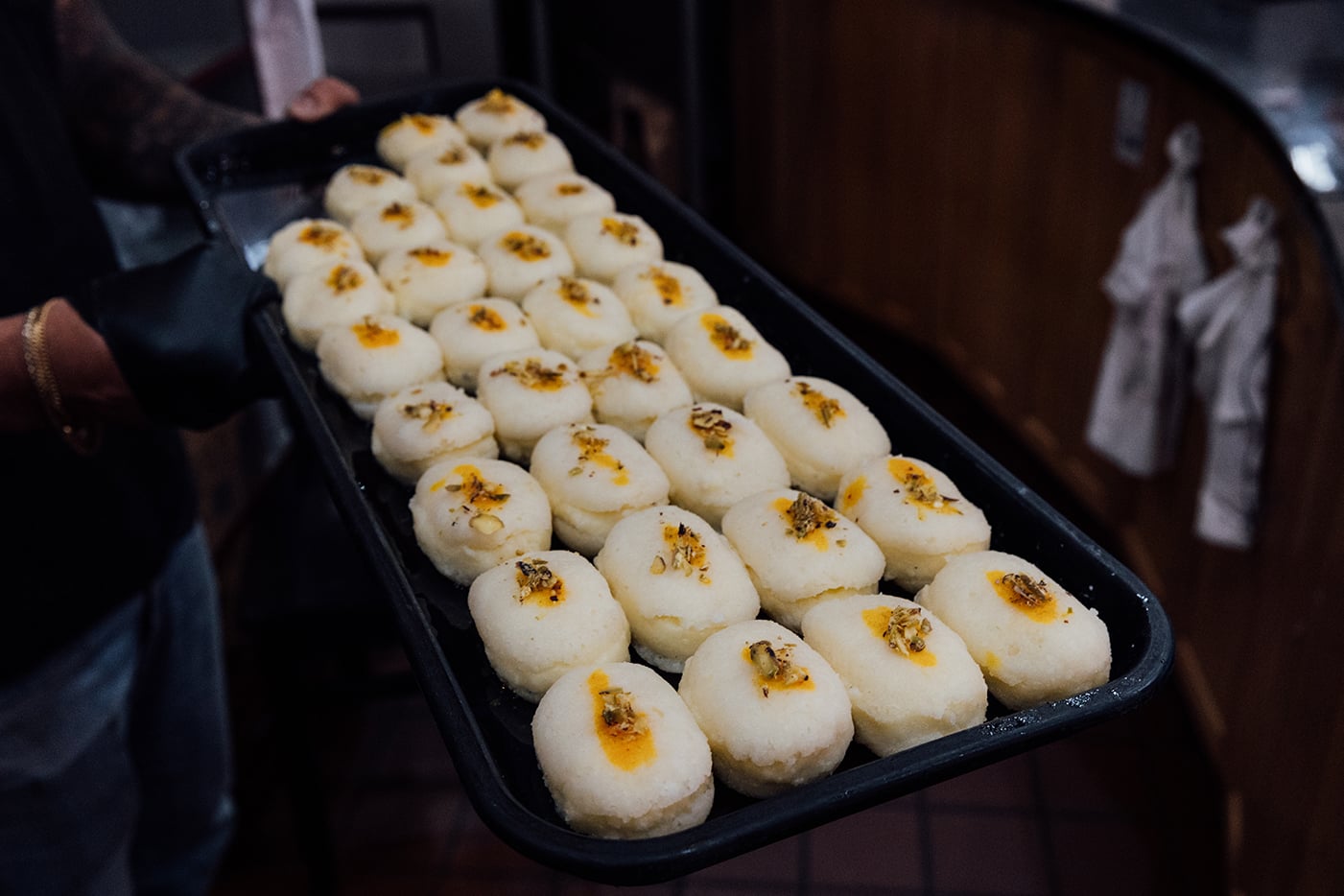 A tray of white and orange sandwich chum chum