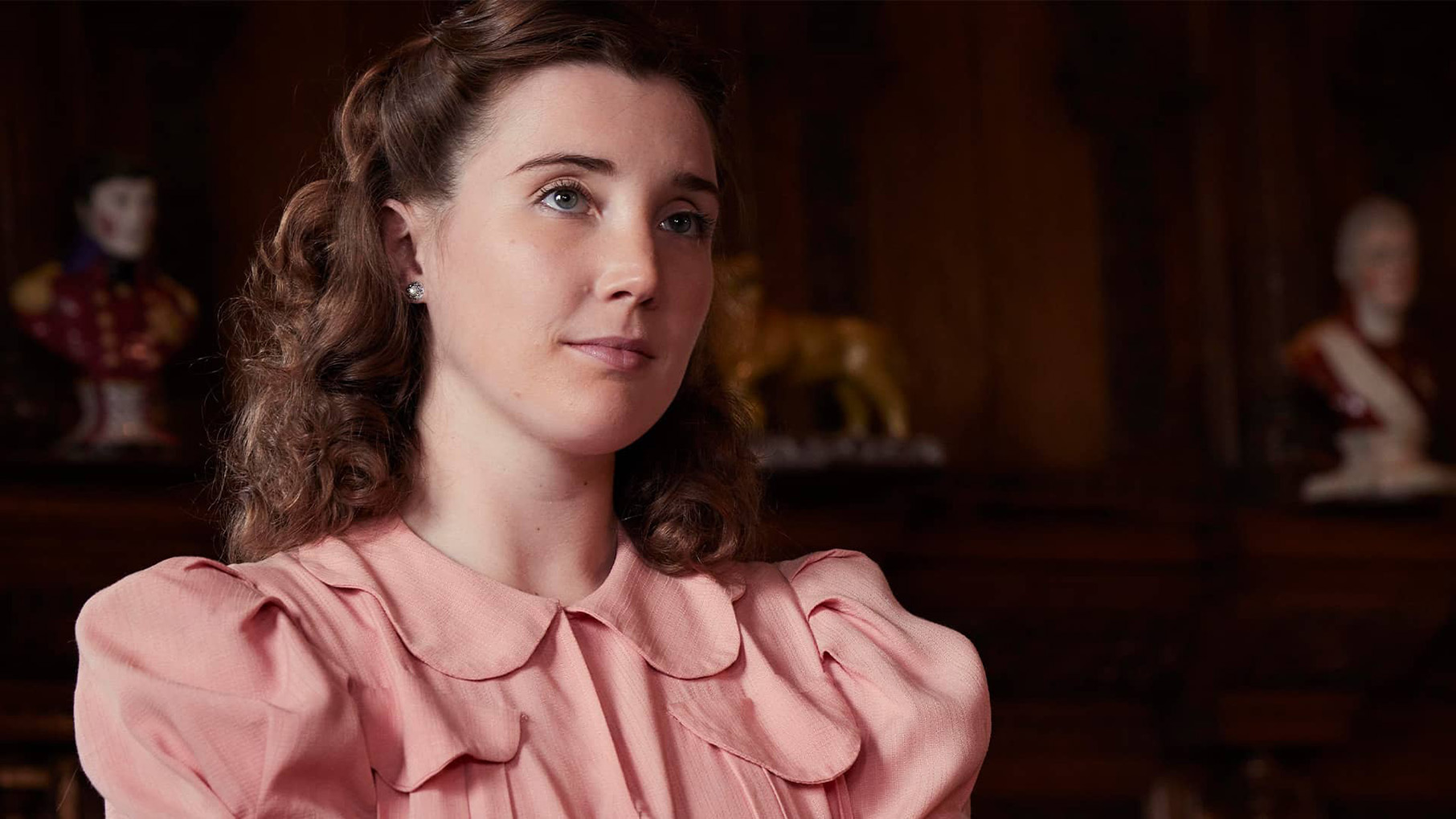 Charlotte Beauvoir in a pink dress