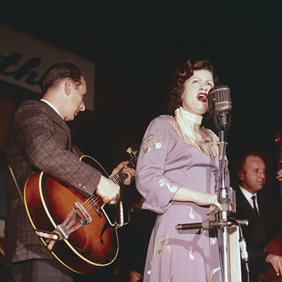 Patsy Cline in a hand-embroidered cowgirl dress made by her mother, 1961. Photo: Courtesy of Les Leverett