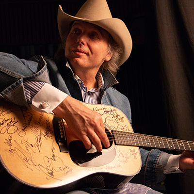 Dwight Yoakam signs a Martin D-28 guitar. Photo: Courtesy of Jared Ames