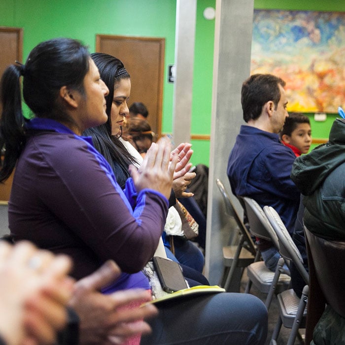 Participants clap after the ESDC presentation for undocumented business owners, parents, and homeowners.