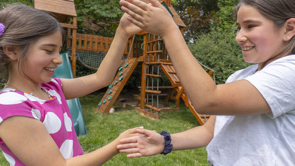 Kids demonstrating their silly handshake. Kids demonstrating their silly handshake.