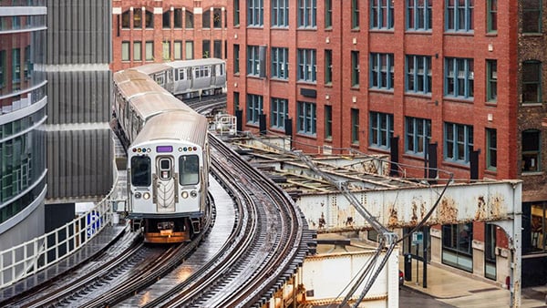 Credit: Albert Pego / iStock An El train on an elevated track in downtown Chicago