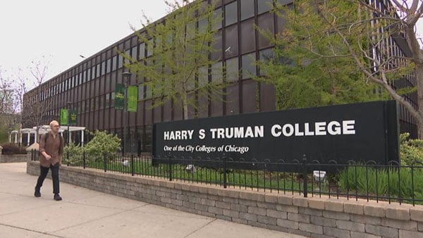Credit: WTTW News A sign reading Harry S. Truman College outside a black building