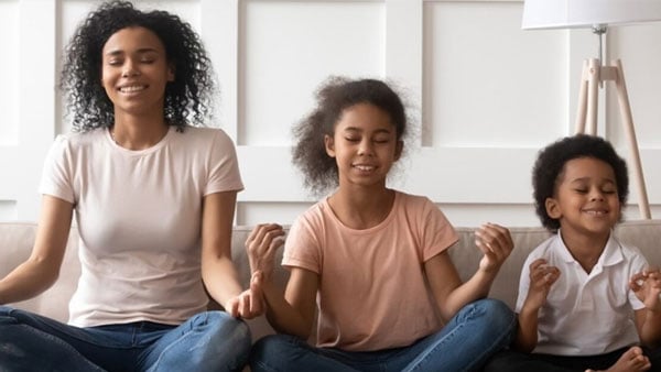 Family meditating. Family meditating.