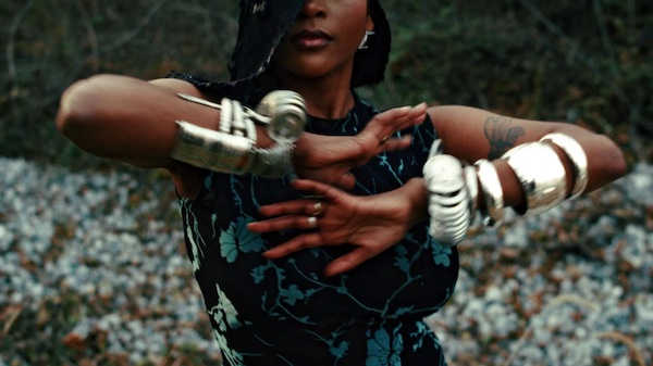 Still from Learenna A. Reynolds’ short film “Raw Head an' Bloody Bone,” which will screen alongside the works of other Black Chicagoan filmmakers at the Music Box Theatre on June 18, 2025, in celebration of Juneteenth. (Courtesy of Learenna A. Reynolds) A woman twists her arms together