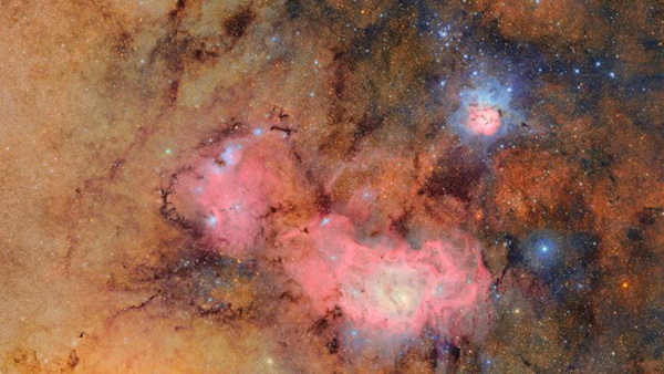 This image provided by the NSF-DOE Vera C. Rubin Observatory shows 678 separate images taken by the observatory in just over seven hours of observing time. Combining many images in this way clearly reveals otherwise faint or invisible details, such as the clouds of gas and dust that comprise the Trifid nebula (top right) and the Lagoon nebula, which are several thousand light-years away from Earth. (NSF-DOE Vera C. Rubin Observatory via AP) This image provided by the NSF-DOE Vera C. Rubin Observatory shows 678 separate images taken by the observatory in just over seven hours of observing time. Combining many images in this way clearly reveals otherwise faint or invisible details, such as the clouds of gas and dust that comprise the Trifid nebula (top right) and the Lagoon nebula, which are several thousand light-years away from Earth. (NSF-DOE Vera C. Rubin Observatory via AP)